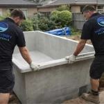 North Sydney Plunge Pools Team inspecting the newly placed precast shell to the ground.