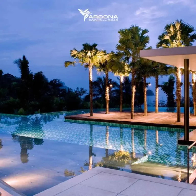 Luxury infinity pool with palm trees and ocean view in a tropical resort setting