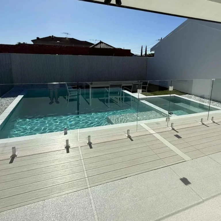 Modern small custom rectangular pool with glass pool fencing and outdoor seating area in Castle Hill NSW