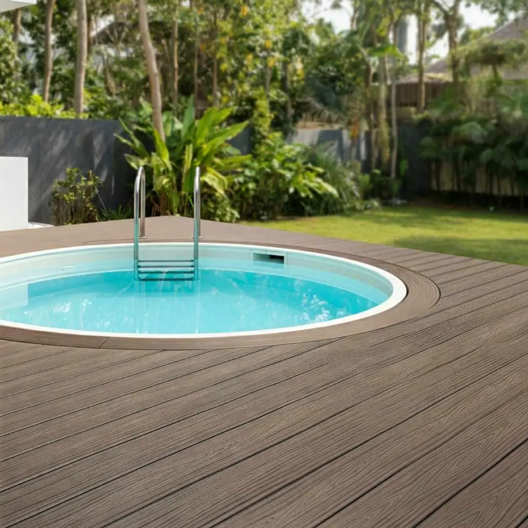 Round precast plunge pool with timber deck surround in a lush backyard garden setting
